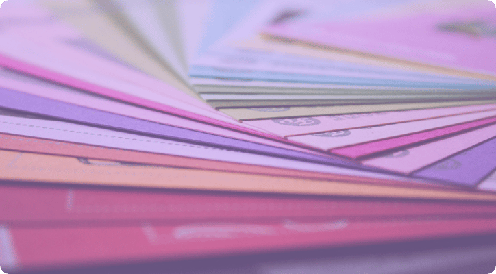 colored folders fanned out on a desk 